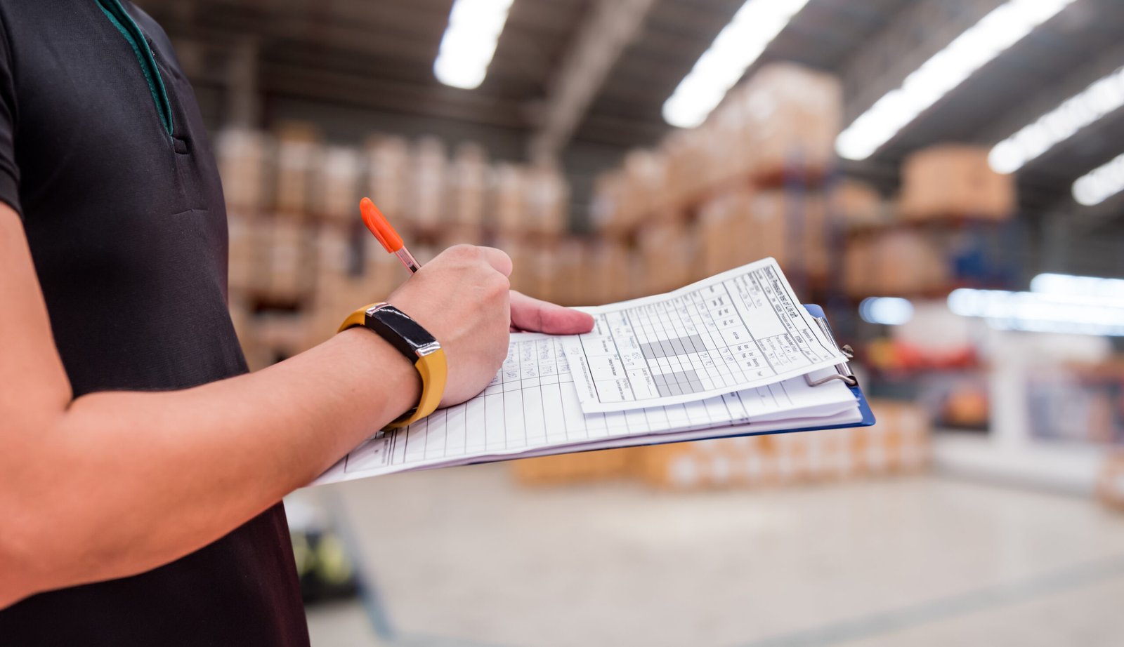 worker in factory, checklist at the warehouse